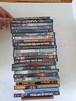 All 24 DVD spines visible to verify titles