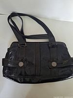 Front view of dark brown La Diva leather purse with dual straps and snap detail