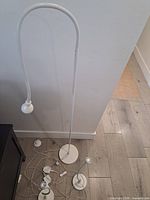 All three white gooseneck lamps laid out