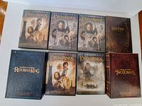Eight DVD releases laid out front covers visible
