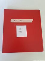 Red three-ring binder closed