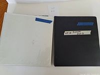 White and black binders closed