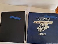 Blue and black binders closed