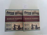 Two green ring-binder albums titled Historische Postkarten front view