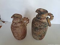 Front view of both pottery jugs