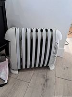 Front and side view of space heater showing fins and general condition