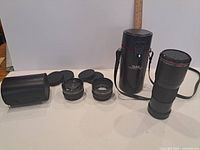 All lenses, both cases, caps visible