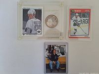 Acrylic display with Upper Deck card and silver coin, additional two Gretzky cards