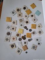 Overall view of all coins laid out on poster board