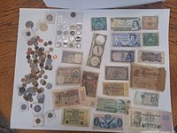Overall view of banknotes and loose coins on board