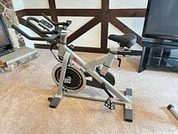 Side view of XTERRA indoor cycle showing frame, flywheel and seat