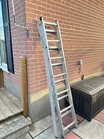 Ladder collapsed leaning against wall