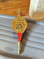 Front view showing brass ship plaque on bellows