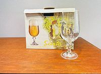 Box labeled Siesta with one stemmed glass displayed