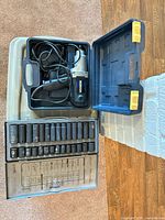 Impact wrench and socket set cases opened