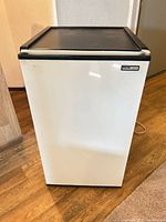 Front view of white Danby Designer mini fridge