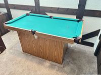 Full view of mini pool table with pedestal base