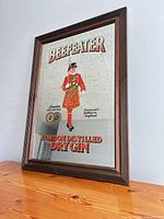 Front view of framed Beefeater advertising mirror