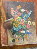 Full view of painting showing bouquet and edge wear