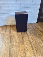 Front view of one Pioneer speaker showing grill and cabinet