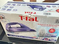 Front of retail box showing T-fal Ultraglide Pro steam iron image and specifications