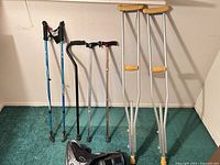 Full view of all mobility aids standing upright against wall