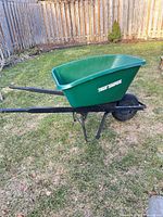 Overall view of green True Temper wheelbarrow