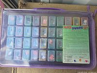 Entire punch set in purple zippered clear-top case