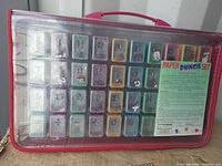 Front view of closed carrying case showing 40 punches and label