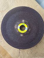 Front view of one Kinik grinding wheel showing label and abrasive surface