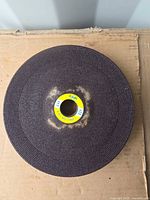 Top view of abrasive wheel showing label and texture