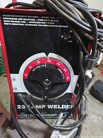 Front of Century welder showing brand, amperage dial and controls