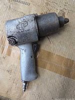 Left side view of Ingersoll Rand impact wrench showing logo and overall wear