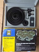 Closed box and open case showing nested hole saws and accessories