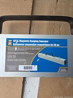 Close-up of product label on sweeper