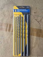 Front of sealed package displaying seven drill bits