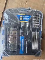 Front view of sealed 79-piece set in plastic carry case