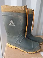 Side view of both Kamik boots showing logo and soles