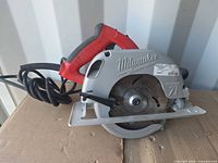Left side view of Milwaukee Tilt-Lok circular saw showing blade, guard and cord