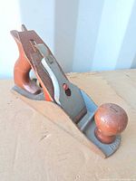 Left-side profile of Bailey hand plane showing handle, knob, body