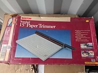 Retail box top displaying Boston Standard 15" Paper Trimmer graphics and information