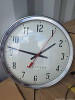 Front view of round Westclox wall clock showing dial, hands and bezel