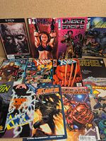 All 13 comics laid out to show titles and covers