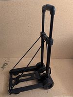 Hand truck standing with handle extended