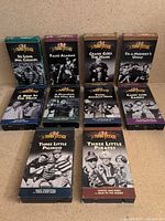 Front view of all ten Three Stooges VHS tapes in two rows