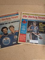 Both magazines side by side showing full covers