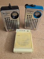 Front view of all three pocket radios