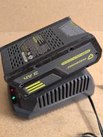 Battery seated on charger showing 40V 3Ah labeling