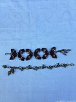 Both bracelets laid flat showing overall designs