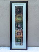 Full view of framed print showing artwork, mat, and frame condition
